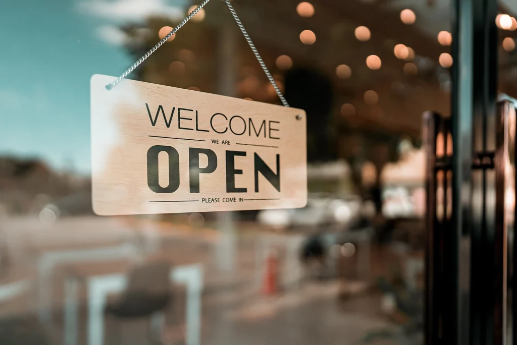 Country-Bank-business-storefront-with-sign-displaying-open-and-welcome