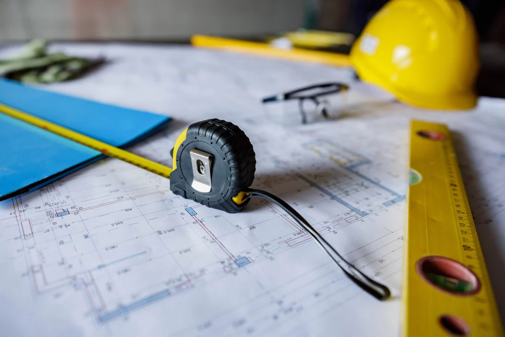 Country-Bank-construction-tools-placed-on-top-of-construction-loan-paperwork
