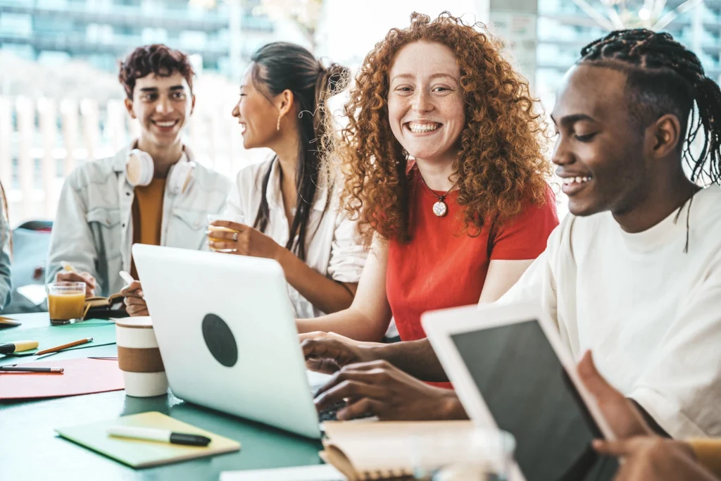 Country-Bank-four-students-with-electronics-coffee-pen-paper