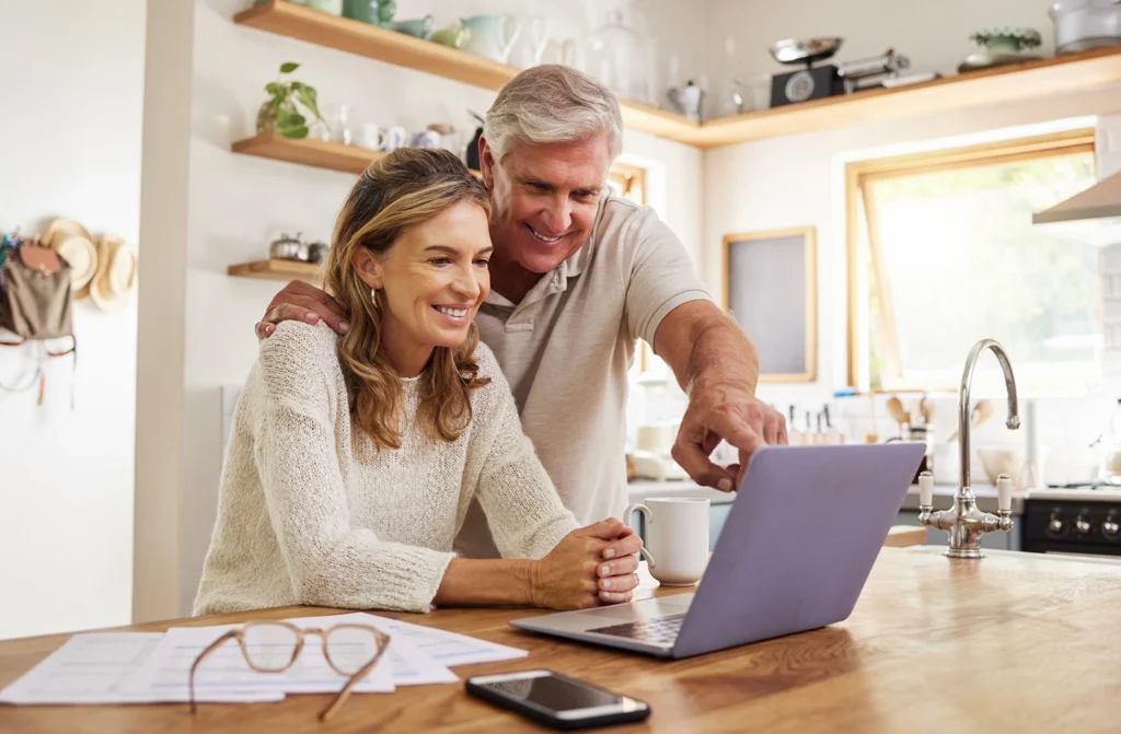 Country-Bank-husband-and-wife-looking-at-money-market-balance-on-computer