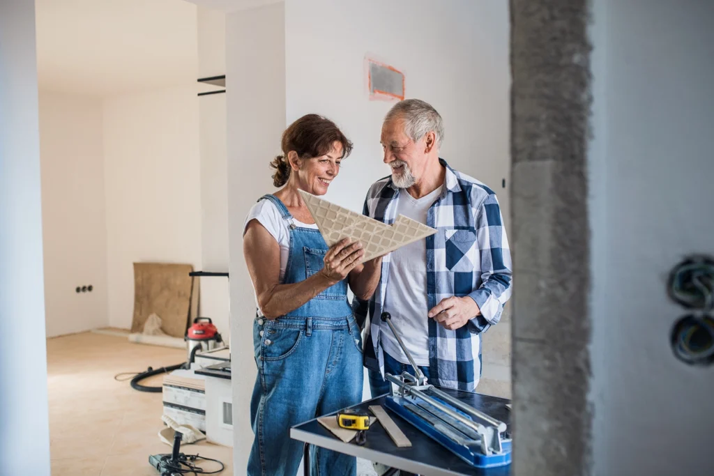 Country-Bank-man-and-woman-using-tools-to-renovate-their-home