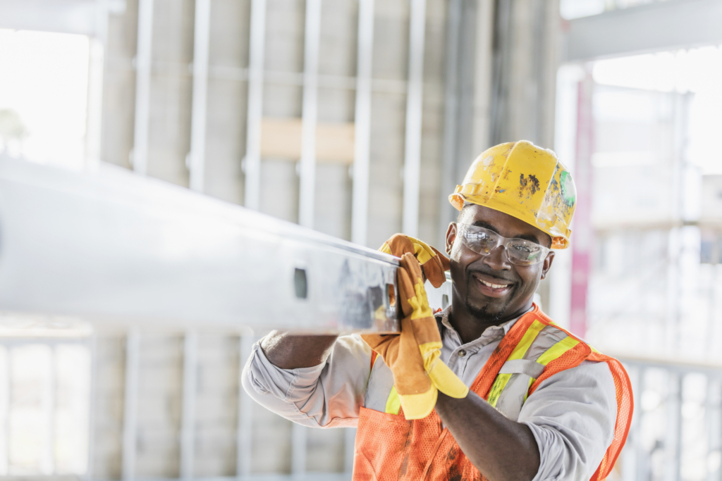 Country-Bank-man-in-construction-zone-carries-post