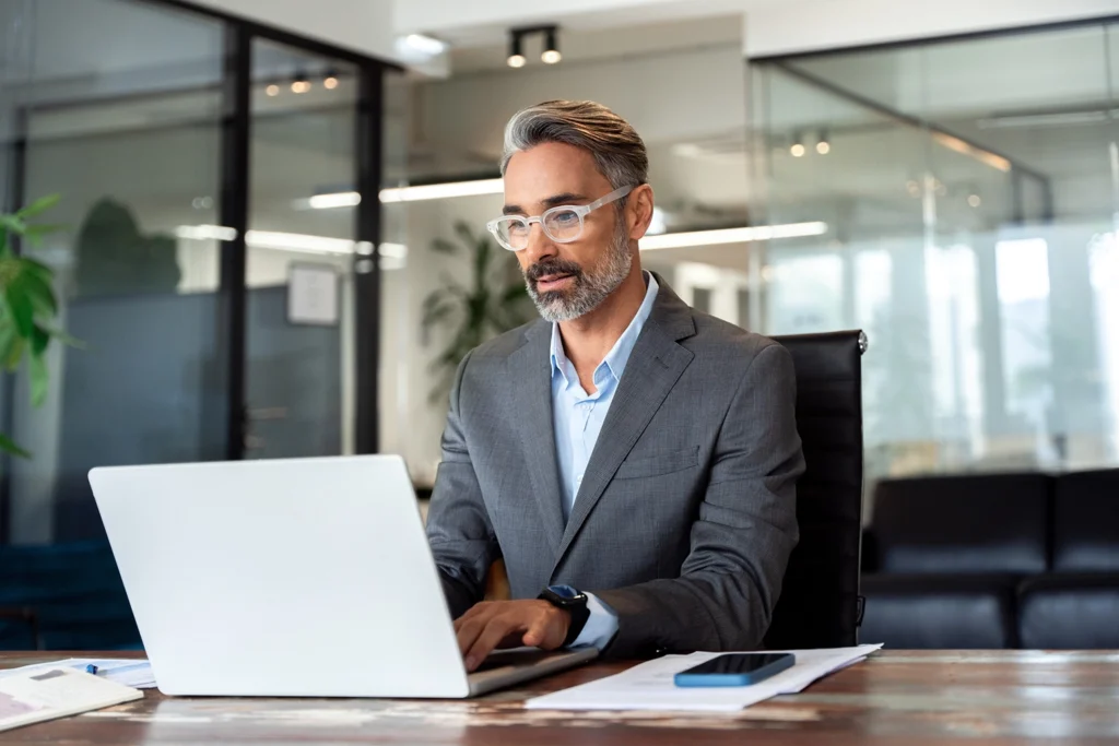 Country-Bank-professional-man-in-business-office-working-from-computer-to-order-line-of-credit-sweep