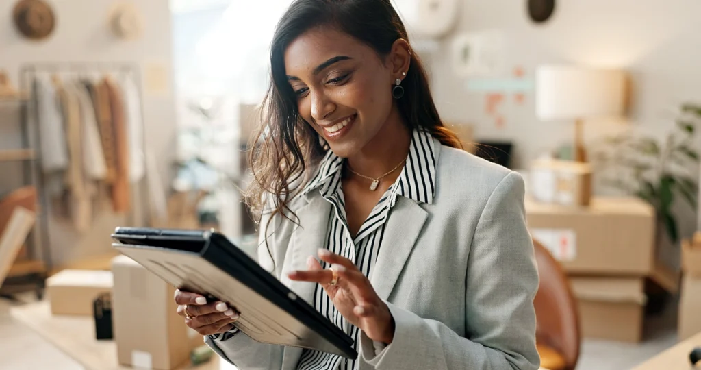 Country-Bank-professional-woman-sitting-at-office-desk-working-on-tablet