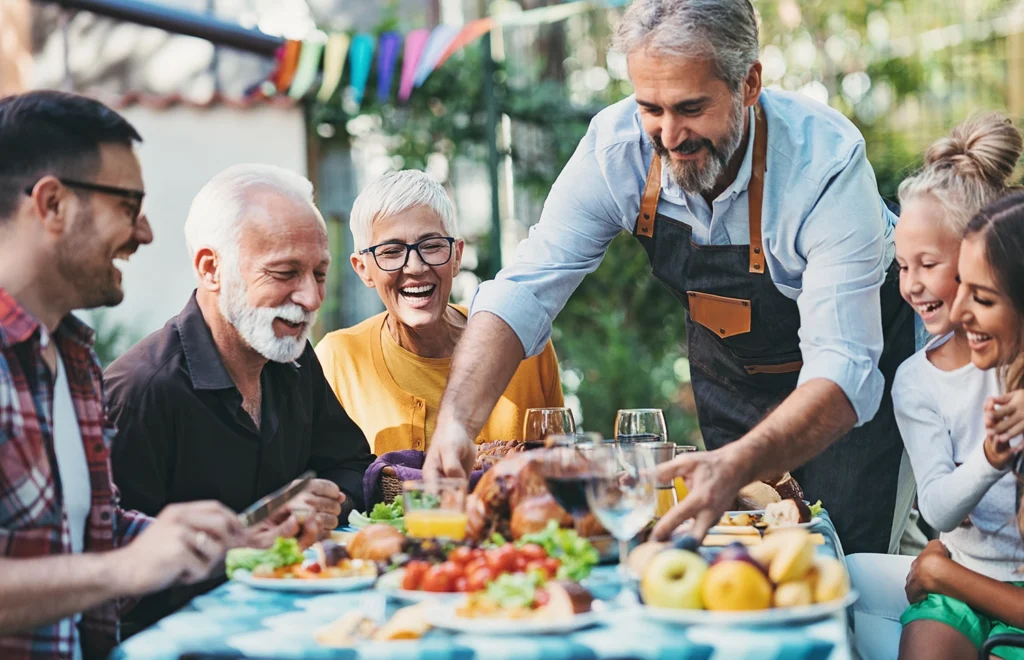 Country-Bank-three-older-friends-at-outdoor-cafe-being-served-fruit-salad