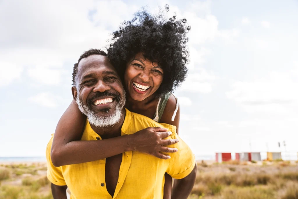 Country-Bank-woman-getting-piggyback-ride-from-husband-outside
