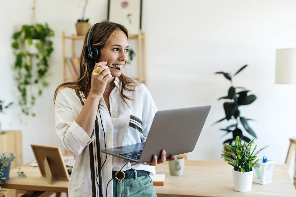Country-Bank-woman-holding-computer-talking-into-headset